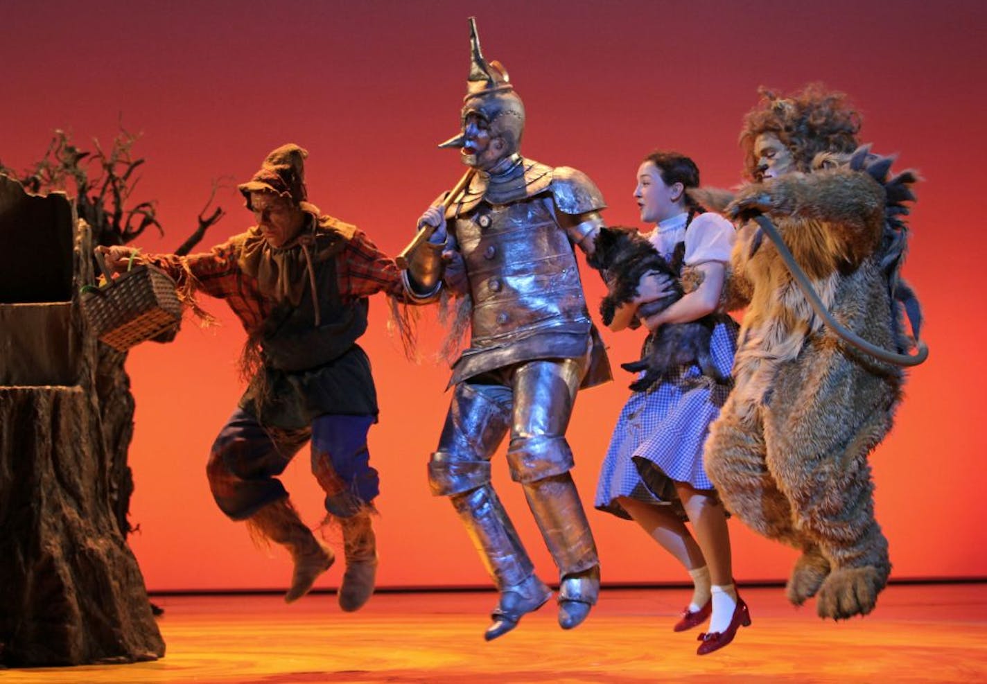 From left: Dean Holt as the Scarecrow, Max Wojtanowicz as the Tin Man, Maeve Coleen Moynihan as Dorothy Gale, Loki the dog as Toto and Reed Sigmund as the Cowardly Lion starred in the 2011 Children's Theatre production of "The Wizard of Oz."