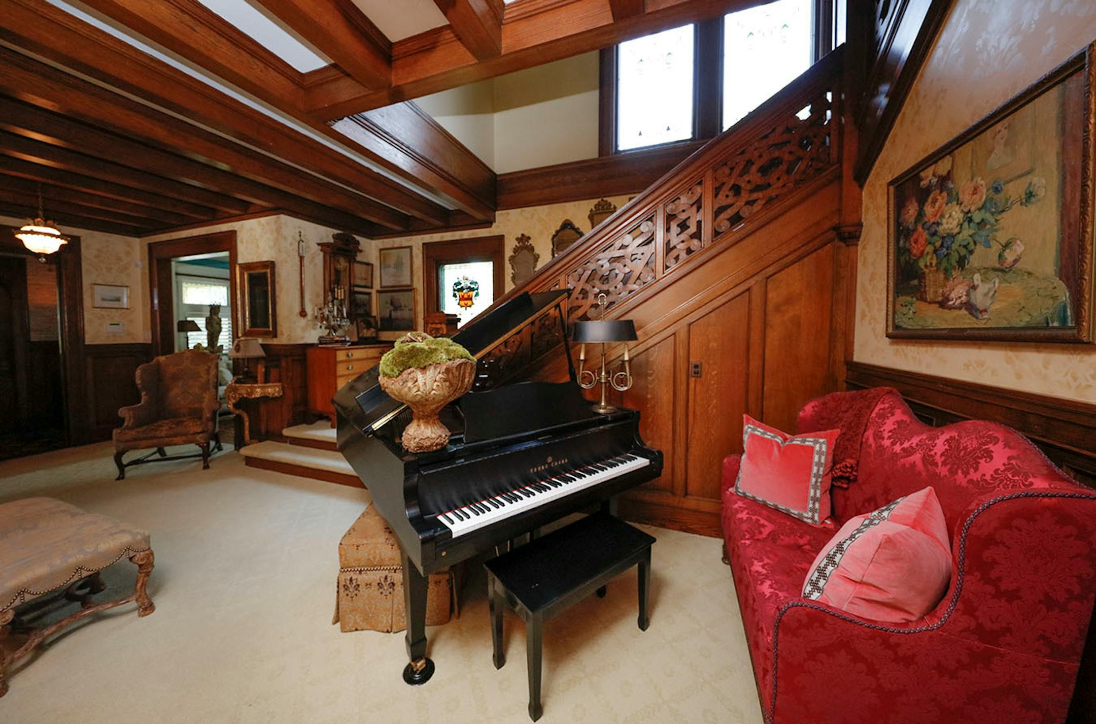 The entry hall is big enough to accommodate a grand piano.The original woodwork is carved Honduran mahogany.
