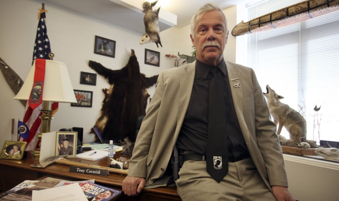 Avid sportsman Rep. Tony Cornish (R) carries a Glock .40 caliber and is seen here in his office at the State Office Building in St. Paul