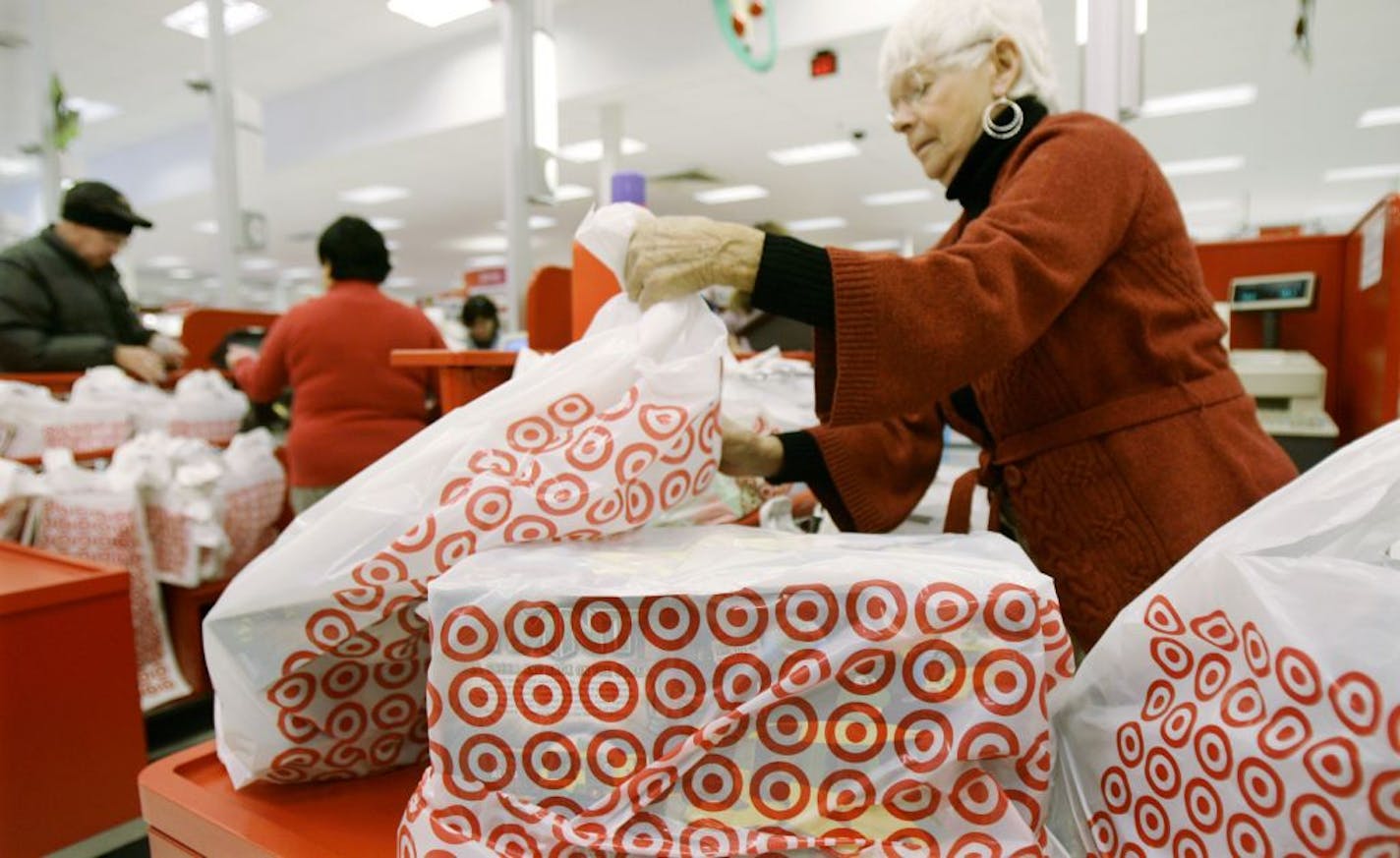 A Target checkout counter. The company now offers only plastic bags at most of its regular stores, and favors plastic over paper at its SuperTargets.