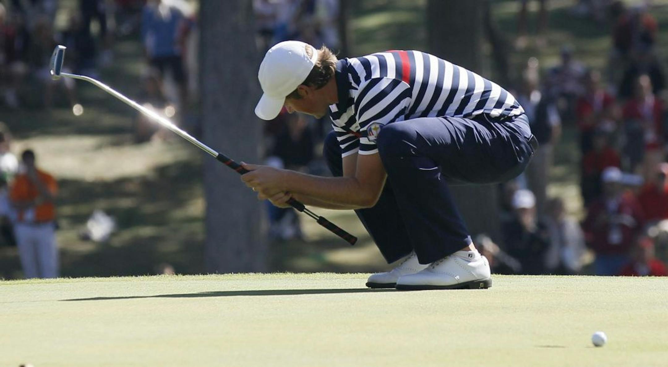 Webb Simpson of the United States reacted Sunday after missing a putt on the 12th hole. Simpson, like many of his teammates, lost his match, Ian Poulter defeating him 2-up.