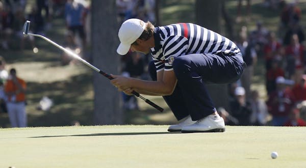 Webb Simpson of the United States reacted Sunday after missing a putt on the 12th hole. Simpson, like many of his teammates, lost his match, Ian Poult