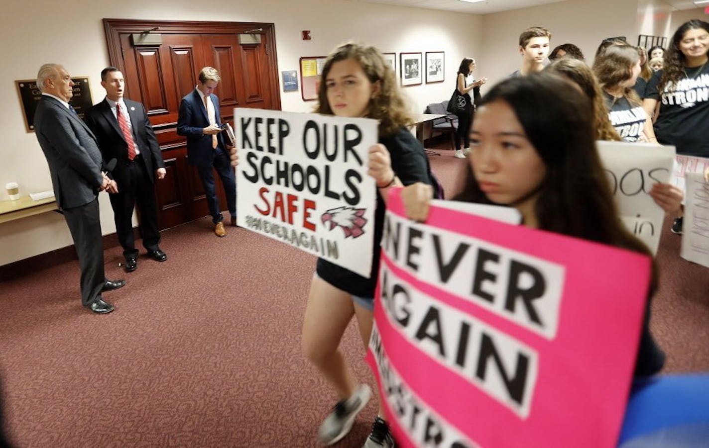 Student survivors from Marjory Stoneman Douglas High School, where moe than a dozen students and faculty were killed in a mass shooting on Wednesday, walk past the house legislative committee rom, to talk to legislators at the state Capitol, regarding gun control legislation, in Tallahassee, Fla., Wednesday, Feb. 21, 2018.