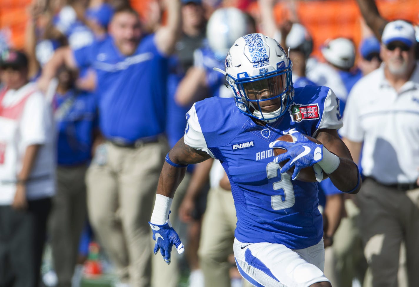 Middle Tennessee wide receiver Richie James (3) runs after catching a pass against Hawaii during the first quarter of the Hawaii Bowl NCAA college football game Saturday, Dec. 24, 2016, in Honolulu. James scored a touchdown on the play. (AP Photo/Eugene Tanner) ORG XMIT: HIET107