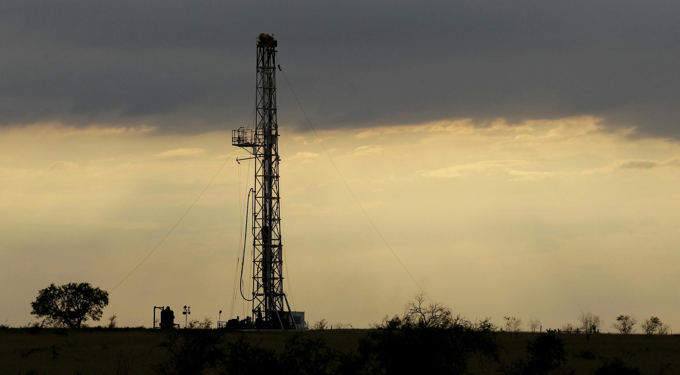 FILE - This May 9, 2012 file photo shows a drilling rig near Kennedy, Texas. Oil companies are finding new ways to export growing amounts of oil from the U.S. despite restrictions on exporting crude.(AP Photo/Eric Gay, File)