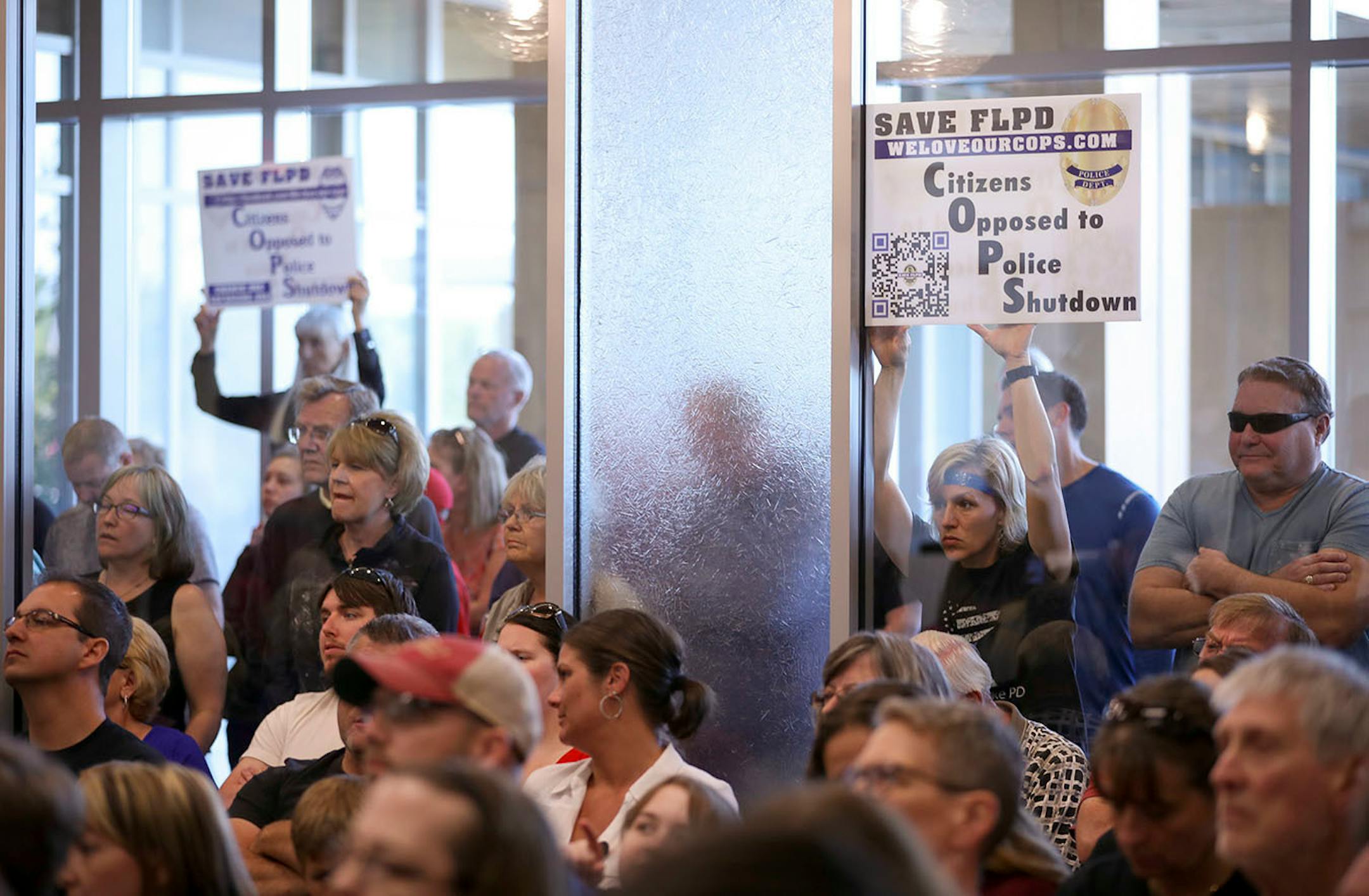 An overflow crowd watched the Forest Lake City Council begin to undo their actions to disband the Police Department a week earlier.