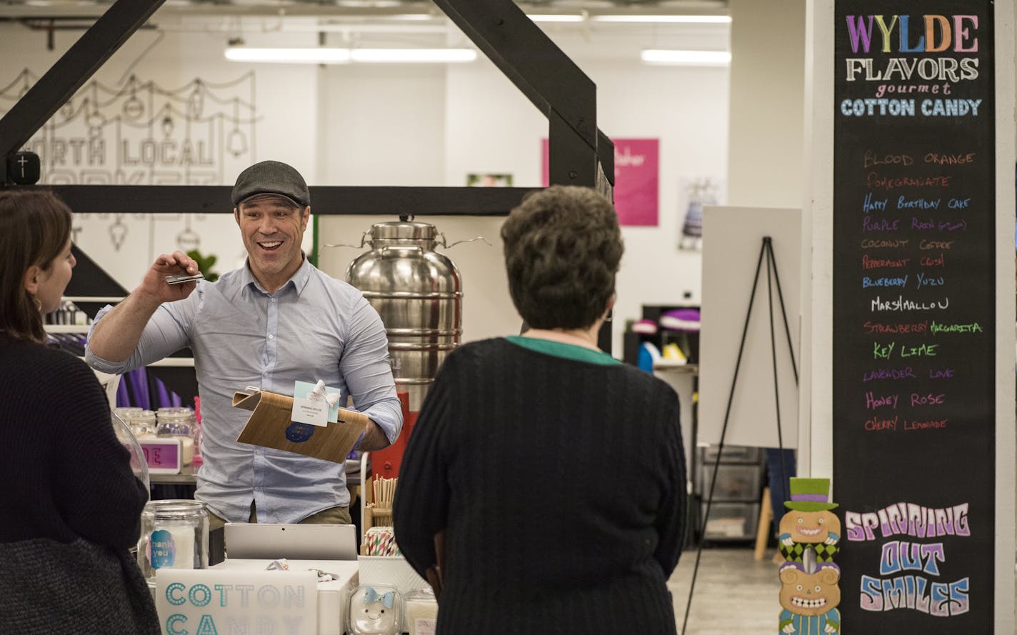 Ben Smith helps out some customers at Spinning Wylde, a cotton candy shop founded by his wife Tevy Phann-Smith. ] RICHARD TSONG-TAATARII &#x2022; richard.tsong-taatarii@startribune.com