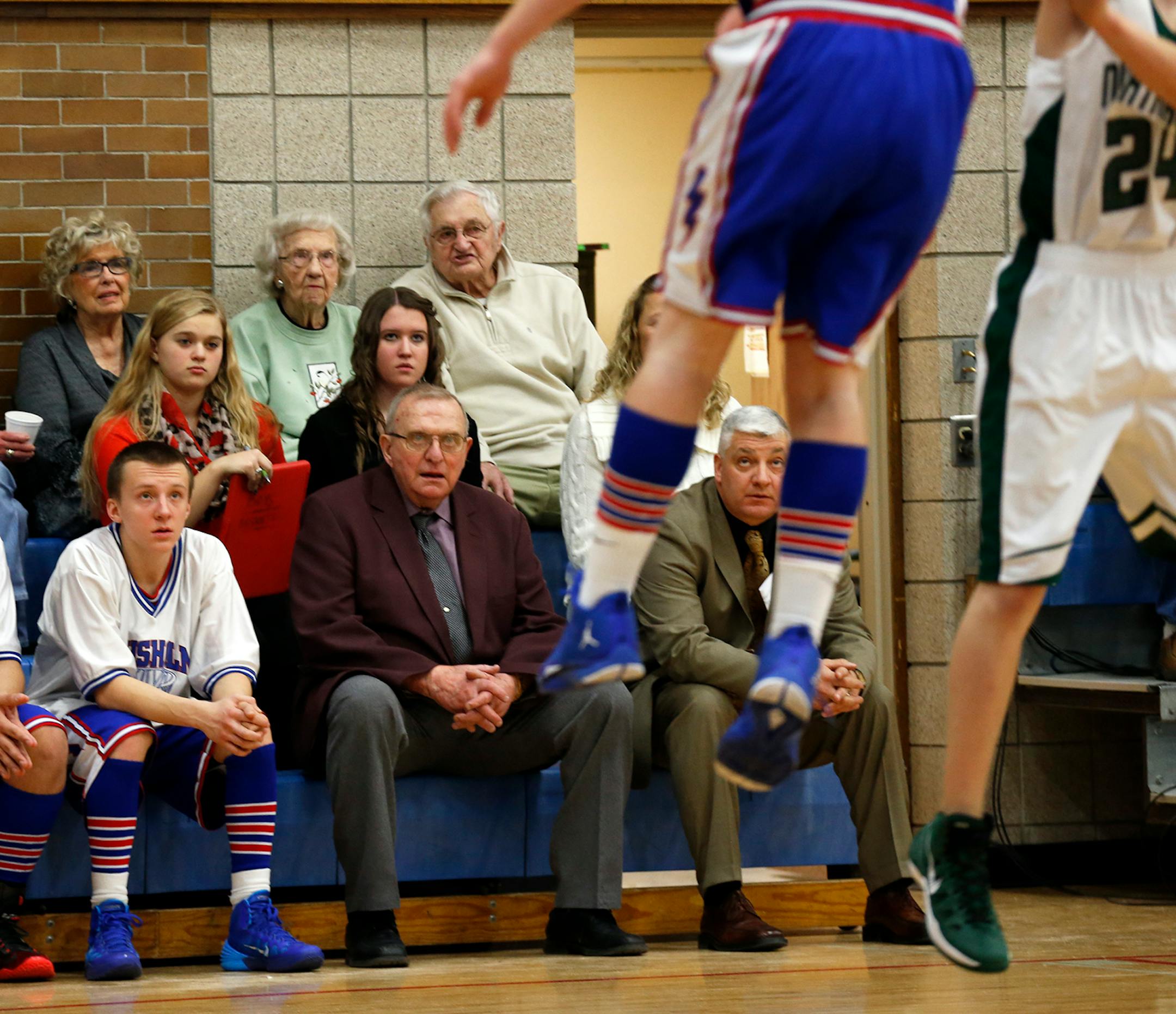 Coach Bob McDonald, center, watched from the bench as his team played against Northeast Range.