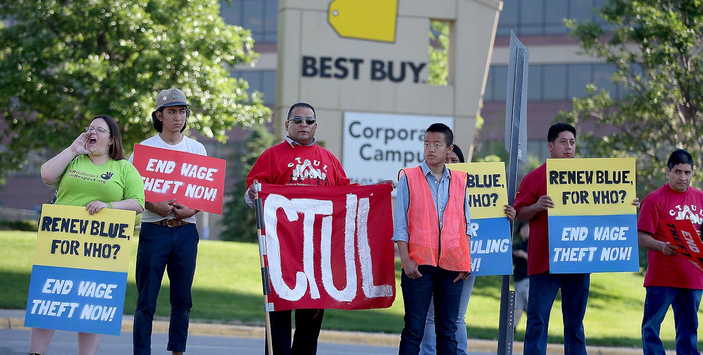 Ricardo Chavez, center in red, who works as a Best Buy janitor, joined other supporters of Centro de Trabajadores Unidos en la Lucha, at the Best Buy Corporate Headquarters to protest the minimum wage during their shareholders meeting, Tuesday, June 9, 2015 in Richfield, MN. ] (ELIZABETH FLORES/STAR TRIBUNE) ELIZABETH FLORES &#x2022; eflores@startribune.com