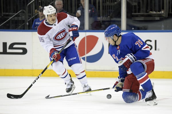 New York Rangers defenseman Brady Skjei (76) blocks a shot by Montreal Canadiens right wing Andrew Shaw (65) during the first period of an NHL hockey 