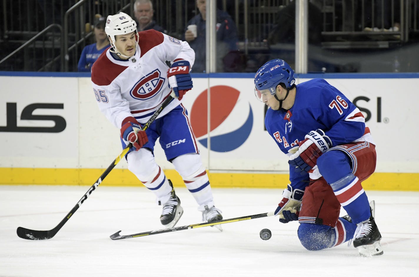 New York Rangers defenseman Brady Skjei (76) blocks a shot by Montreal Canadiens right wing Andrew Shaw (65) during the first period of an NHL hockey game Tuesday, Nov. 6, 2018, at Madison Square Garden in New York. (AP Photo/Bill Kostroun)