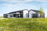 A sculptural home of metal, glass and wood creates “Nordic zen” vibes while offering just the right backdrop for the homeowner to display his extensive art collection. Set against a prairie in the east metro suburb of Grant, the house features walls of glass, plus design elements that frame views of wetlands. Passive ventilation and local sourcing are also emphasized in the design.
