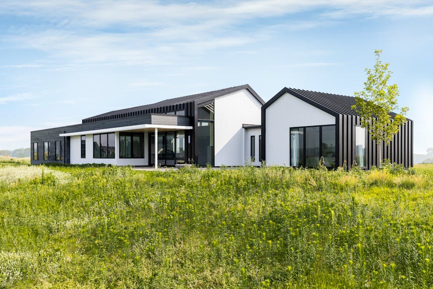 A sculptural home of metal, glass and wood creates “Nordic zen” vibes while offering just the right backdrop for the homeowner to display his extensive art collection. Set against a prairie in the east metro suburb of Grant, the house features walls of glass, plus design elements that frame views of wetlands. Passive ventilation and local sourcing are also emphasized in the design.