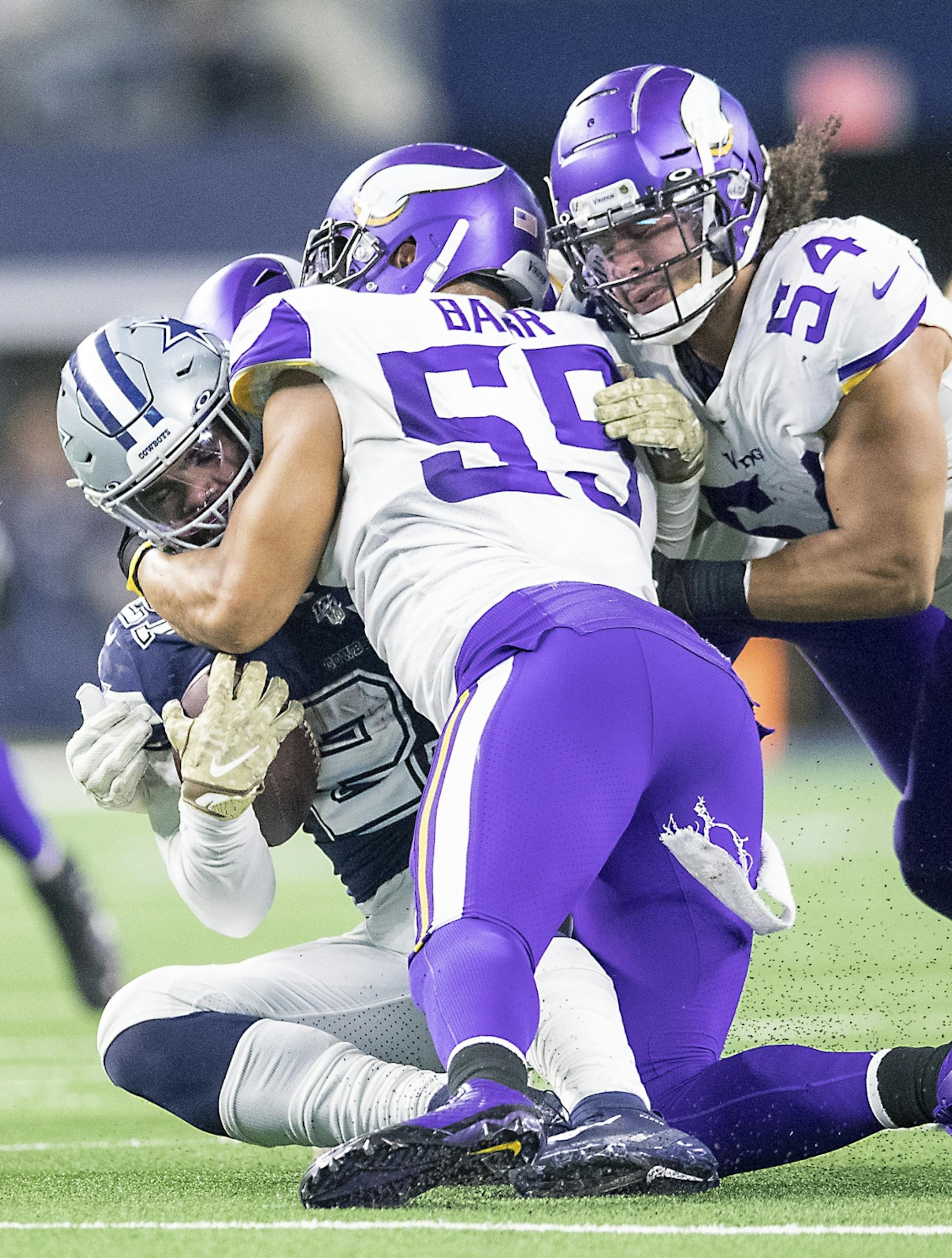 Minnesota Vikings' outside linebacker Anthony Barr and middle linebacker Eric Kendricks stopped Dallas Cowboys' running back Ezekiel Elliott in the second quarter.