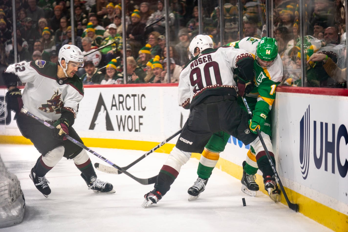 Coyotes defenseman Janis Moser shoved Wild forward Joel Eriksson Ek against the wall in a fight for the puck Saturday night at Xcel Energy Center.