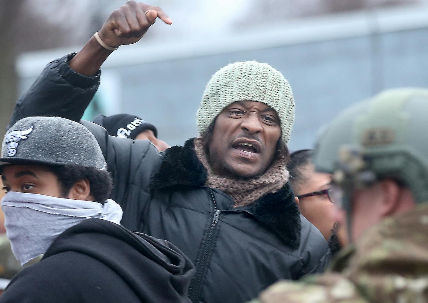 Protestors yelled profanities, flipped them off, and spit on them during a protest over the death of Jamar Clark, at the Fourth Police Precinct, Wednesday, November 4, 2015 in Minneapolis, MN. ] (ELIZABETH FLORES/STAR TRIBUNE) ELIZABETH FLORES &#x2022; eflores@startribune.com