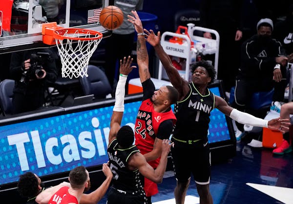 Raptors guard Norman Powell shot the ball as Timberwolves guard Malik Beasley defended during the second quarter of Friday night's game.