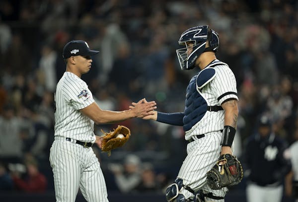 New York Yankees starting pitcher Jonathan Loaisiga and catcher New York Yankees catcher Gary Sanchez congratulated each other after the Yankees defea