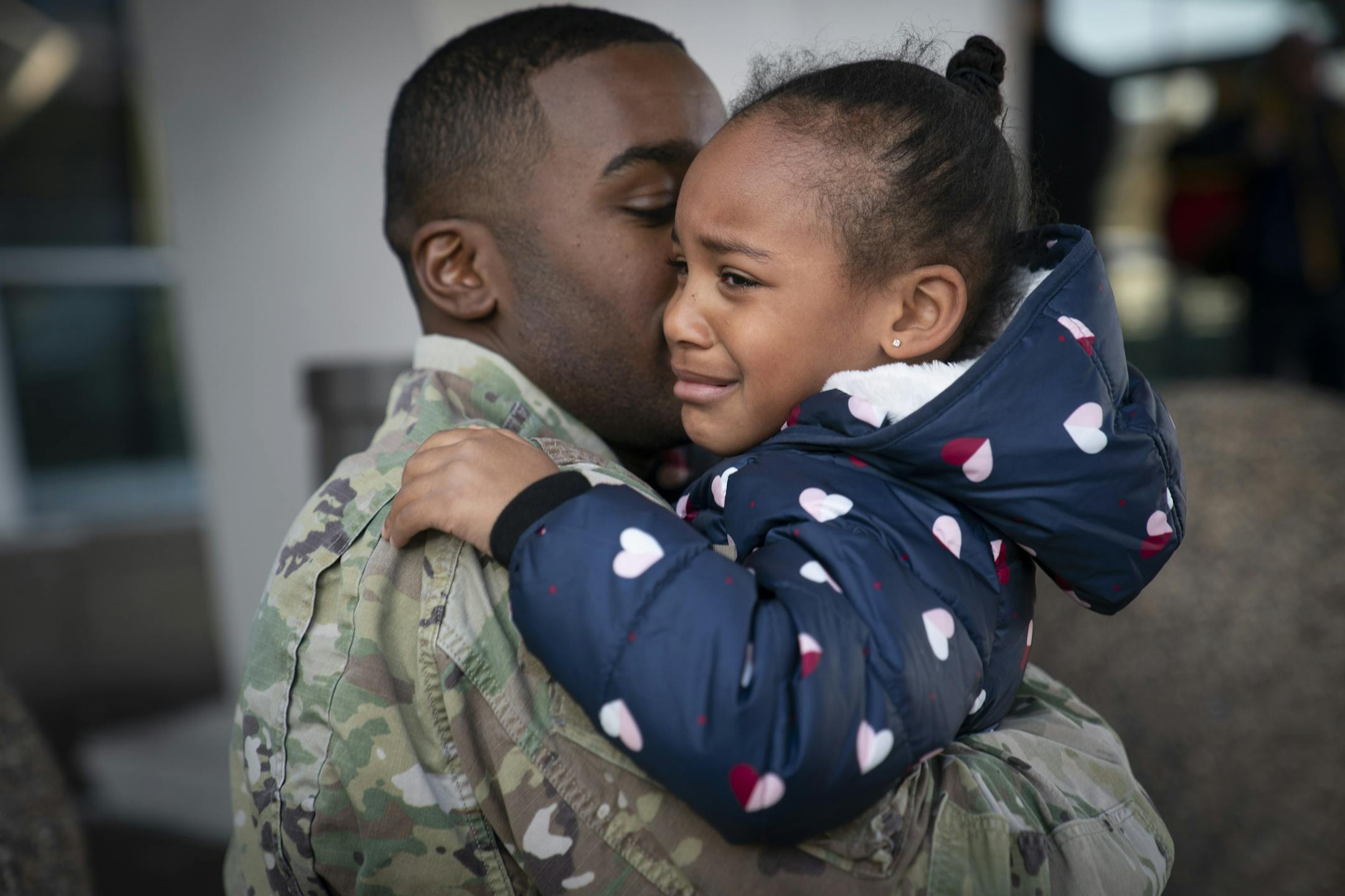 Deonte Haynes hugged his daughter Jalei, 5, at the airport where he was leaving to return to Fort Hood Texas before he leaves for the Middle East where he is a helicopter mechanic for the Army National Guard on Tuesday, December 3, 2019. He had come come for a few days of Thanksgiving. ] RENEE JONES SCHNEIDER &#xa5; renee.jones@startribune.com
