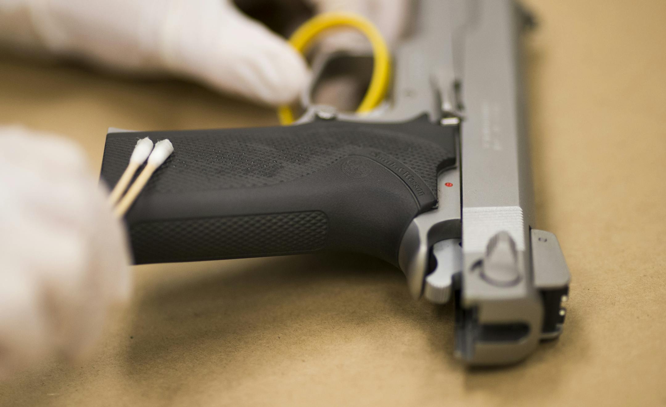 DNA supervisor Kristine Deters demonstrated how she collects DNA from firearms at the BCA in St. Paul, Minn. on Thursday, December 18, 2014. ] RENÉE JONES SCHNEIDER reneejones@startribune.com