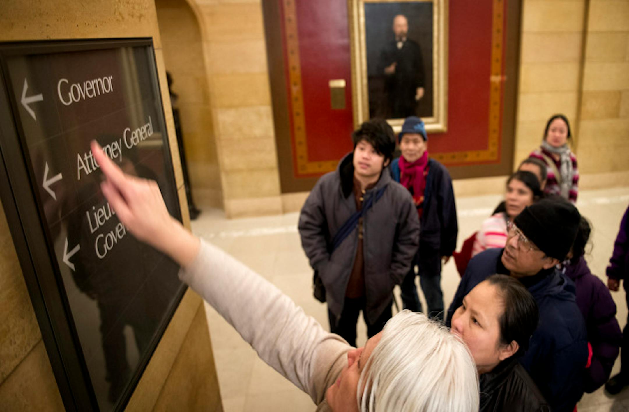 MORE executive director, Cathy Rucci, explained that Governor Dayton was the highest ranking legislator in the state.  50 refugees from Burma and Nepal who attend the M.O.R.E. Multicultural School for Empowerment in St. Paul toured the Capitol  Monday, March 4, 2013.  They were there to lobby legislators in the school's district for bills on the minimum wage and education funding.  They also received a first hand civics lesson on who the the Governor is, what the U.S. and state flags represent and how to say the work elevator.   ]   GLEN STUBBE * gstubbe@startribune.com