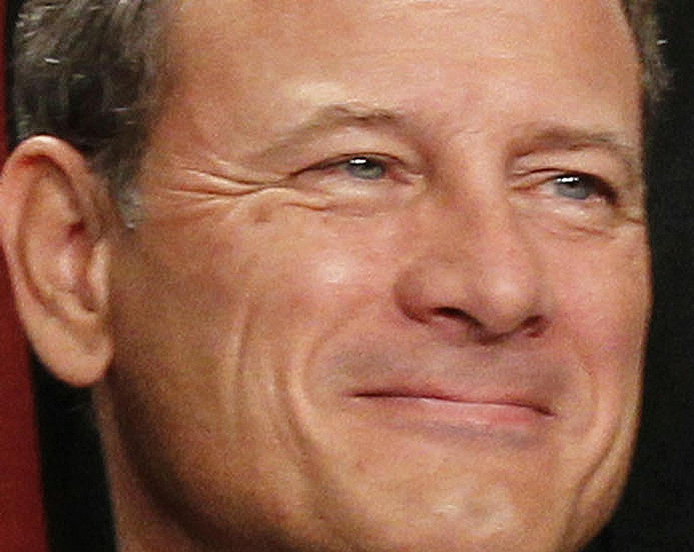 FILE - In this Oct. 8, 2010 file photo, Chief Justice John G. Roberts is seen during the group portrait at the Supreme Court Building in Washington. The Supreme Court struck down a federal law Thursday that forces private health organizations to denounce prostitution as a condition to get AIDS funding. Roberts, writing for the court, said the law's anti-prostitution pledge improperly restricts the groups' First Amendment rights. (AP Photo/Pablo Martinez Monsivais, File)