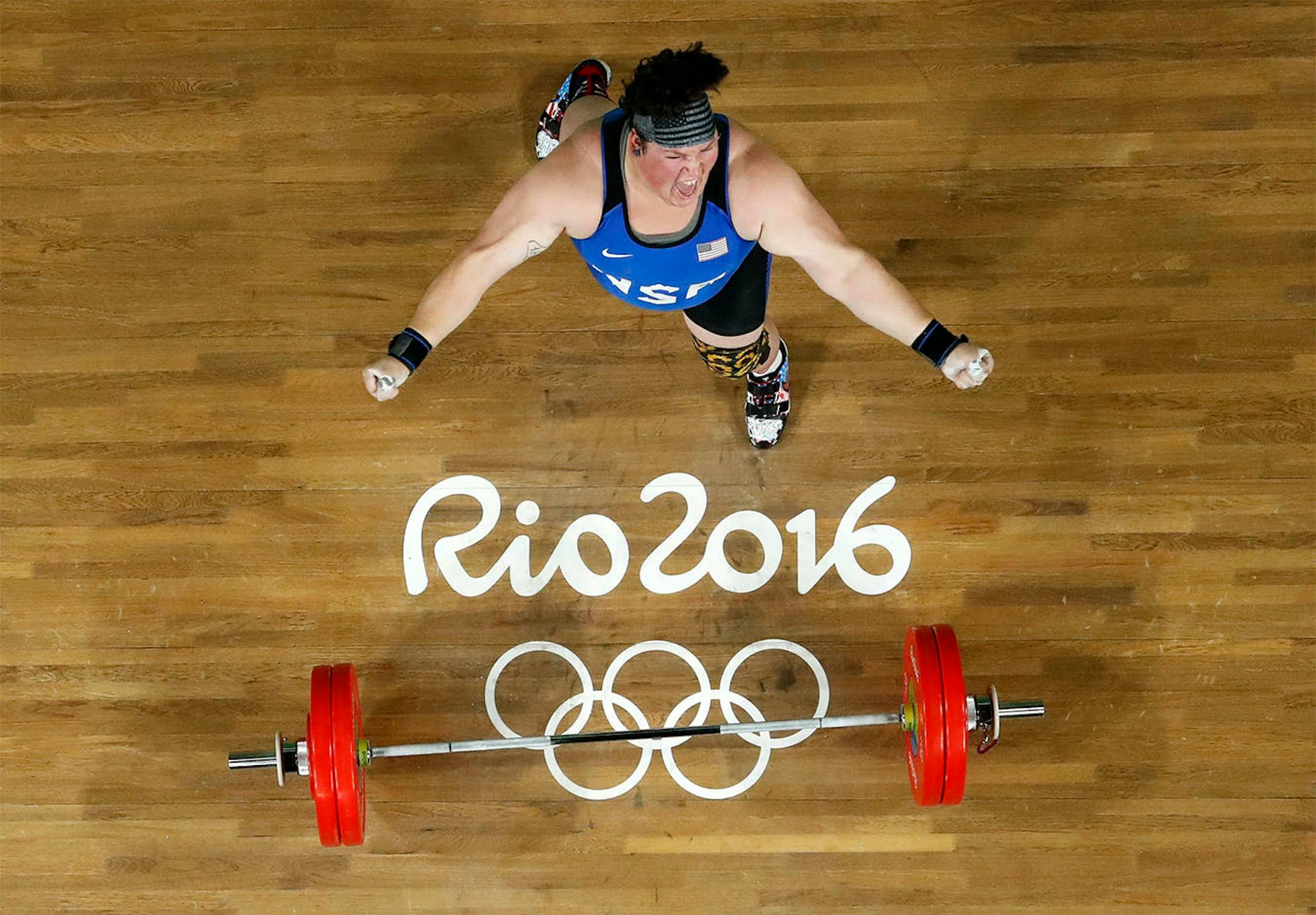 Sarah Elizabeth Robles, of the United States, celebrates after a lift during the women's 75kg weightlifting competition at the 2016 Summer Olympics in Rio de Janeiro, Brazil, Sunday, Aug. 14, 2016. Robles won the bronze medal.