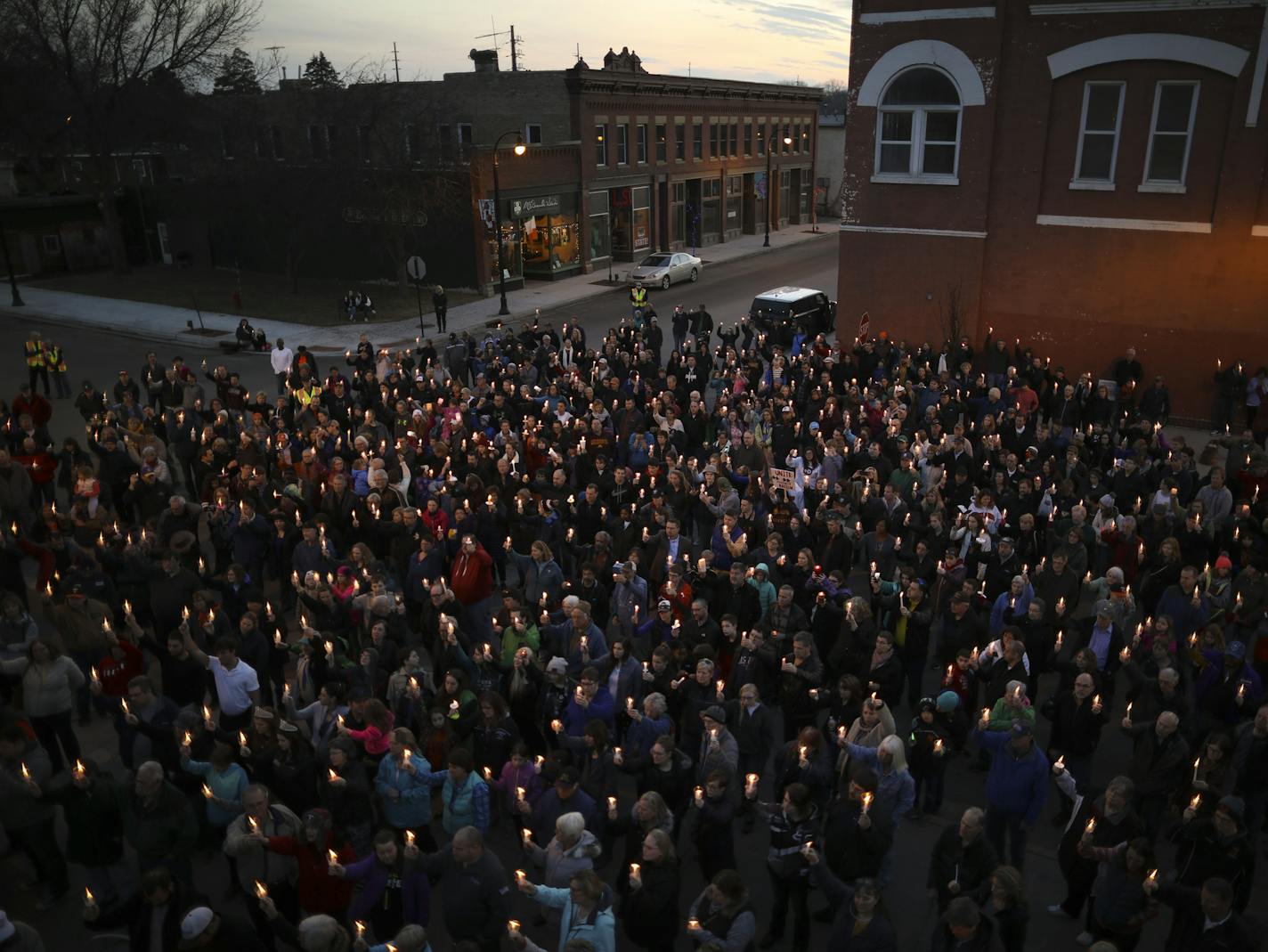 More than 1,000 people attended a candlelight gathering in Delano on Sunday, March 19, after a black family's home was tagged with racial slurs.