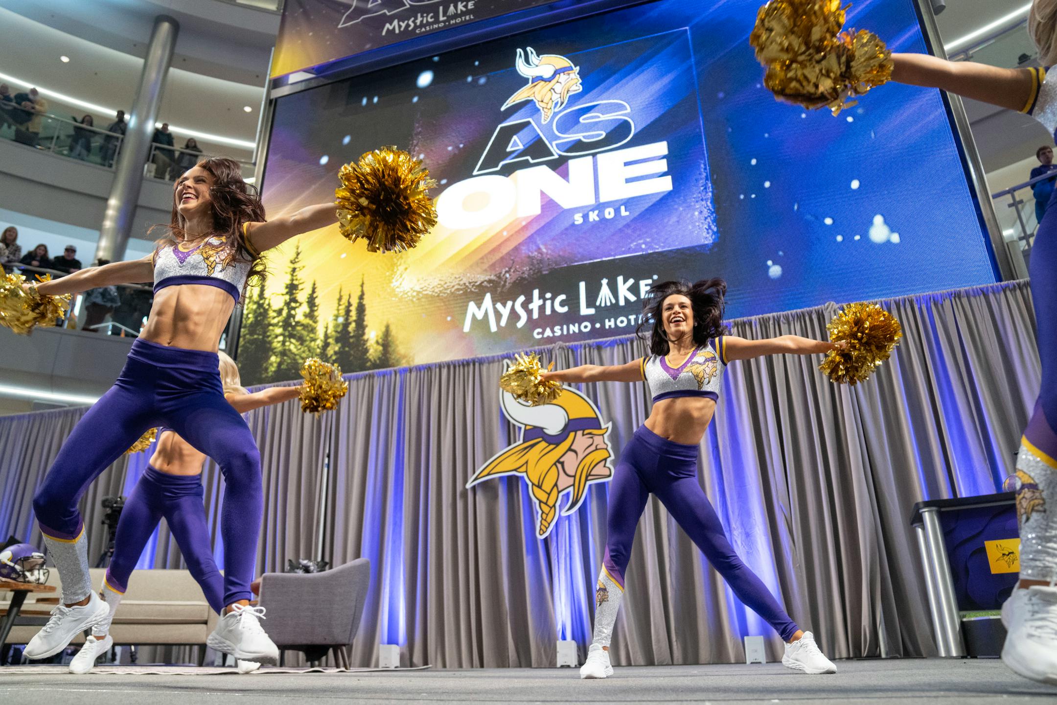 The Minnesota Vikings cheerleaders perform on stage during a Vikings fan rally.