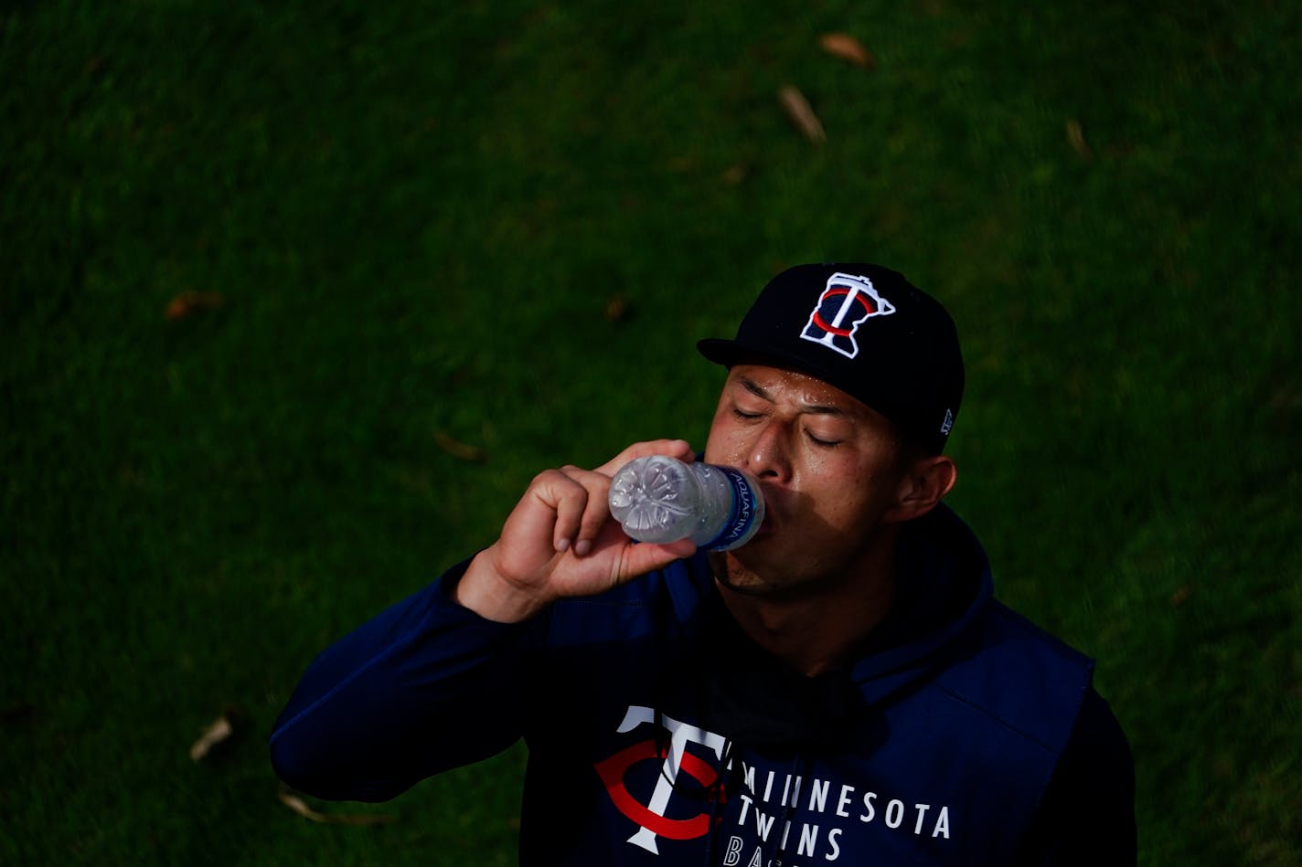 Minnesota Twins' Rob Refsnyder takes a drink during spring training baseball practice on Wednesday, Feb. 24, 2021, in Fort Myers, Fla. (AP Photo/Brynn Anderson)