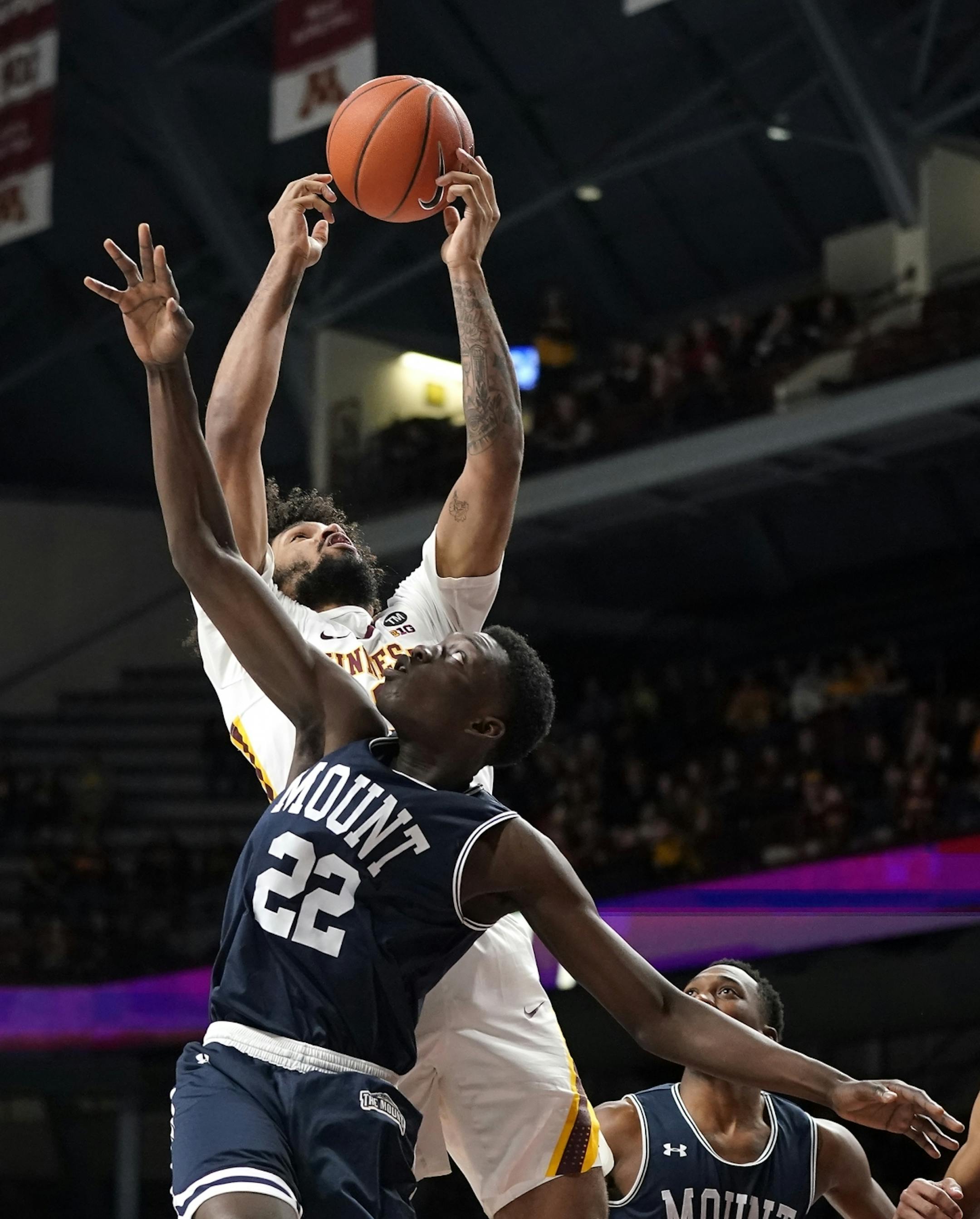 Minnesota forward Jordan Murphy (3) gets a rebound against Mount St. Mary's forward Nana Opoku (22) during the first half.