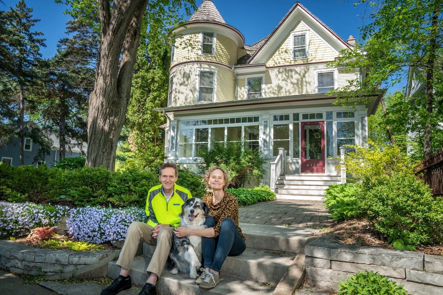 Dick and Nancy Bottorff with their Australian shepherd, Boomer, in front of their Minneapolis home. After interest in their house waned, they changed their listing to "not available."