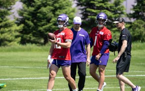 Quarterbacks Max Brosmer (12) and Zach Zebrowski (1) participate in the Vikings' rookie minicamp Friday at TCO Performance Center.