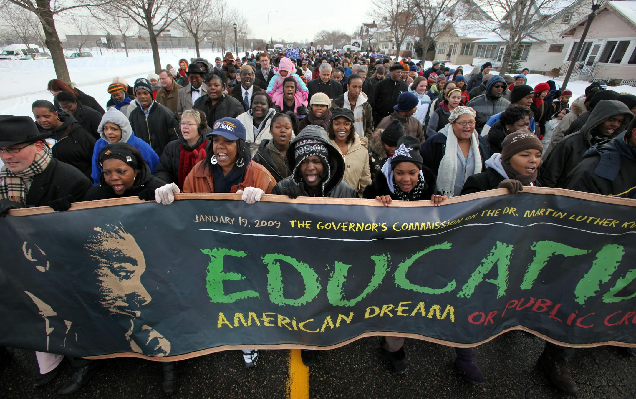A crowd of about a thousand marched along St. Paul's Marshall Avenue to celebrate the life and legacy of civil rights leader Dr. Martin Luther King Monday.