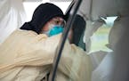 Cheryl Odegaard, a medical assistant at St. Luke's Respiratory Clinic, administered a COVID-19 test to a patient in their drive thru testing site in S