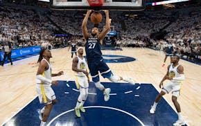 Timberwolves center Rudy Gobert (27) dunks in the first half against the Golden State Warriors in Game 5 of their NBA Western Conference playoff semif