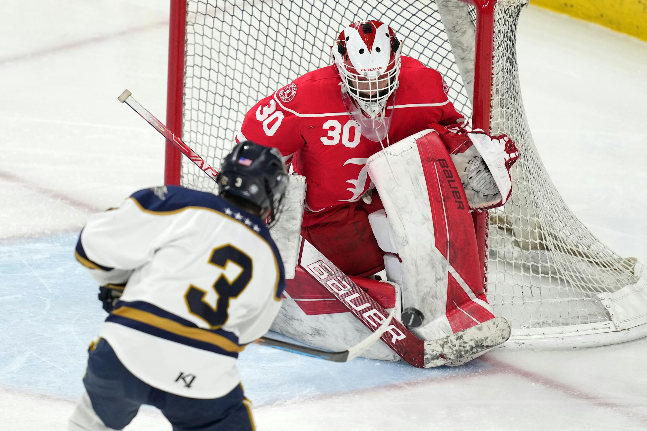 Hermantown forward Samuel Swenson (3) takes a shot on Luverne goaltender Tyler Arends (30) in the second period of a MSHSL Class 1A quarterfinal hockey game between Luverne and Hermantown.