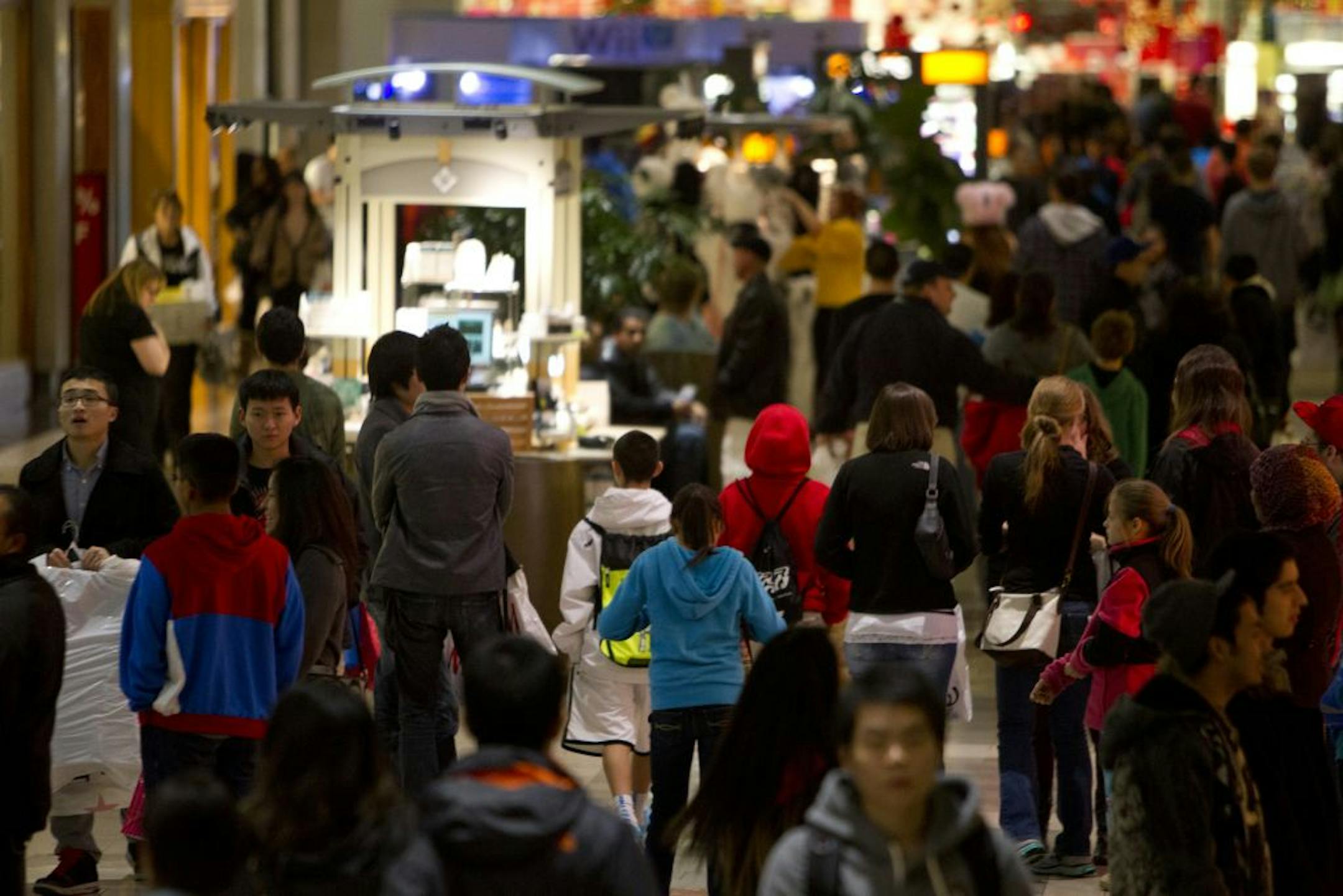 Black Friday shoppers make their way through Washington Square Mall early Friday morning in Tigard, Ore., Friday Nov. 23, 2012. For decades, stores have opened their doors in wee hours of the morning on the day after Thanksgiving known as Black Friday. But this year, that changed when major chains from Target to Toys R Us opened on Thanksgiving itself, turning the traditional busiest shopping day of the year into a two-day affair.