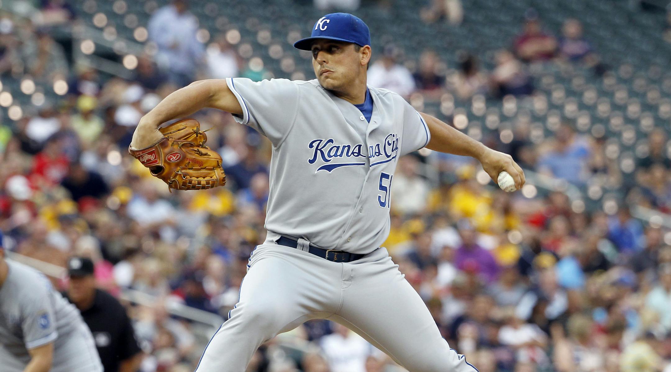 Kansas City Royals starting pitcher Jason Vargas delivers to the Minnesota Twins during the first inning of a baseball game in Minneapolis, Monday, Aug. 18, 2014. (AP Photo/Ann Heisenfelt)