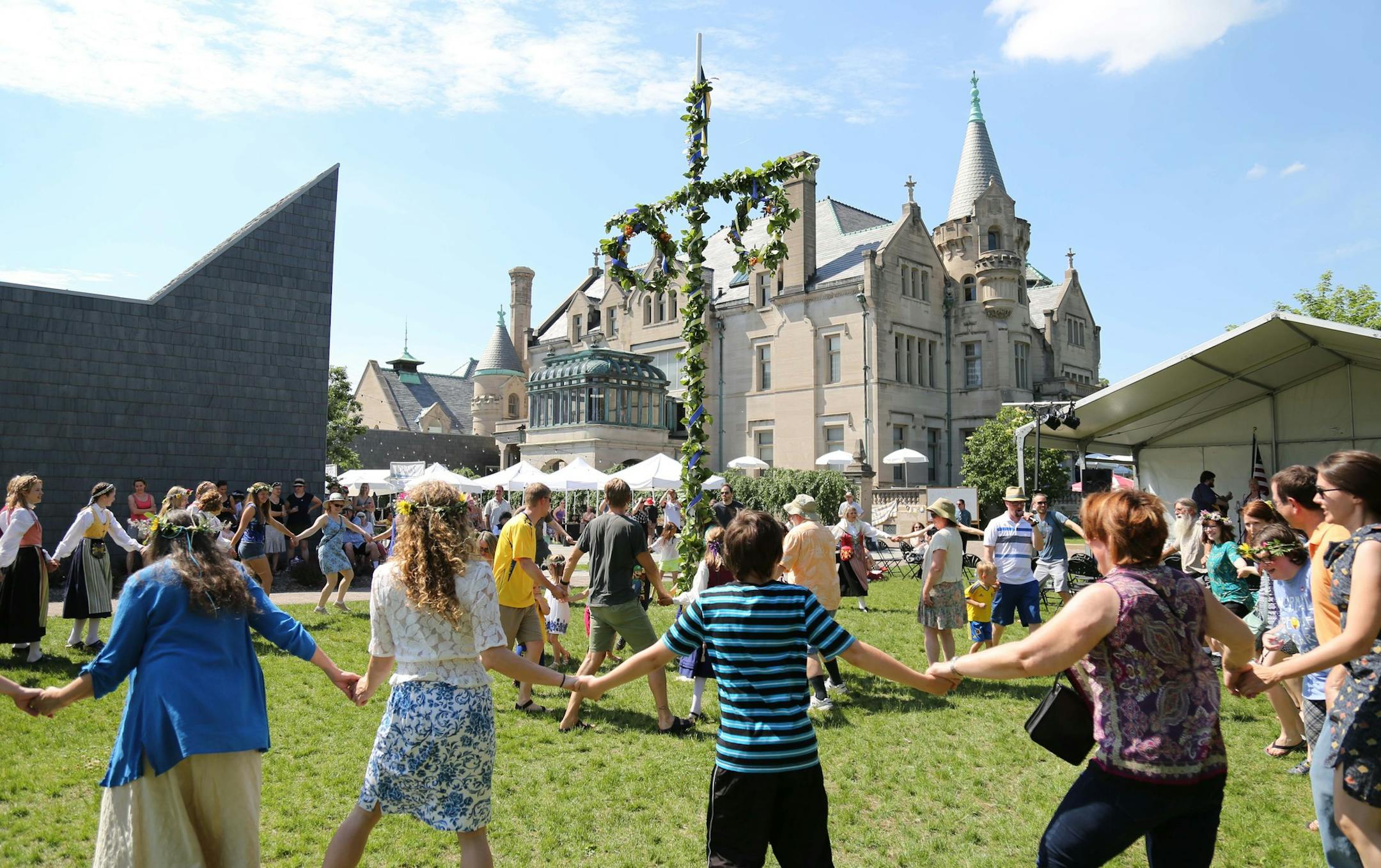 The celebration of midsommar includes dancing around the decorated pole at the American Swedish Institute.