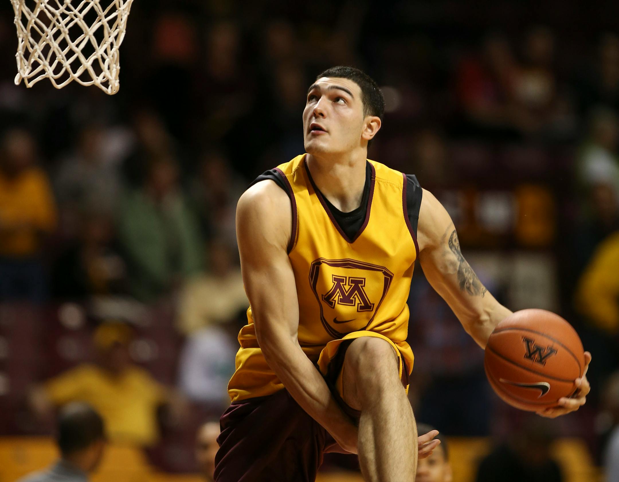 Josh Martin tried a fancy dunk as he warmed up for the second half of the intrasquad scrimmage Sunday afternoon. ] JEFF WHEELER • jeff.wheeler@startribune.com The Gopher men's basketball team held an intrasquad scrimmage Sunday afternoon, October 26, 2014 at Williams Arena.