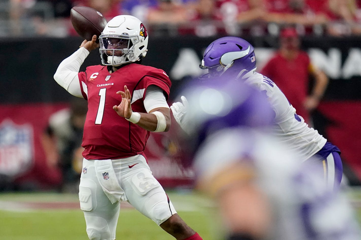 Arizona Cardinals quarterback Kyler Murray (1) throws against the Minnesota Vikings during the second half of an NFL football game, Sunday, Sept. 19, 2021, in Glendale, Ariz. (AP Photo/Ross D. Franklin)