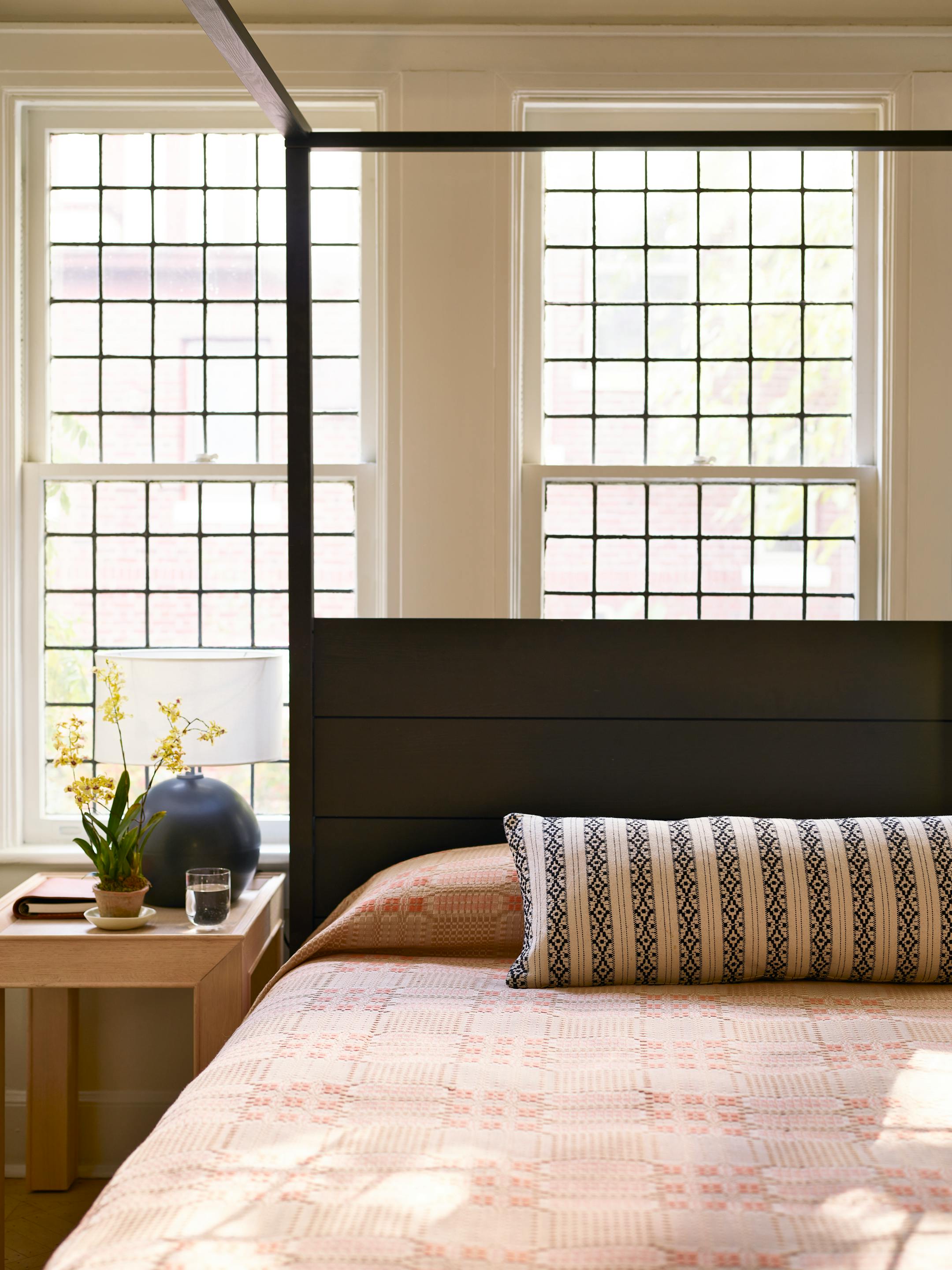 BC-ASK-MARTHA-BLANKETS-COVERLETS-ART-NYTSF — Women of Oaxaca Viento lumbar pillow (similar to shown), $225, the-citizenry.com. IKEA Yttervag bed in Black, $499, ikea.com. Ballard Designs Jonah side table, $699, ballarddesigns.com. Folk Abigail ball lamp in Black Glaze, $499, rejuvenation.com. (Frank Frances/Martha Stewart Living Online) — ONLY FOR USE WITH ARTICLE SLUGGED — BC-ASK-MARTHA-BLANKETS-COVERLETS-ART-NYTSF — OTHER USE PROHIBITED.