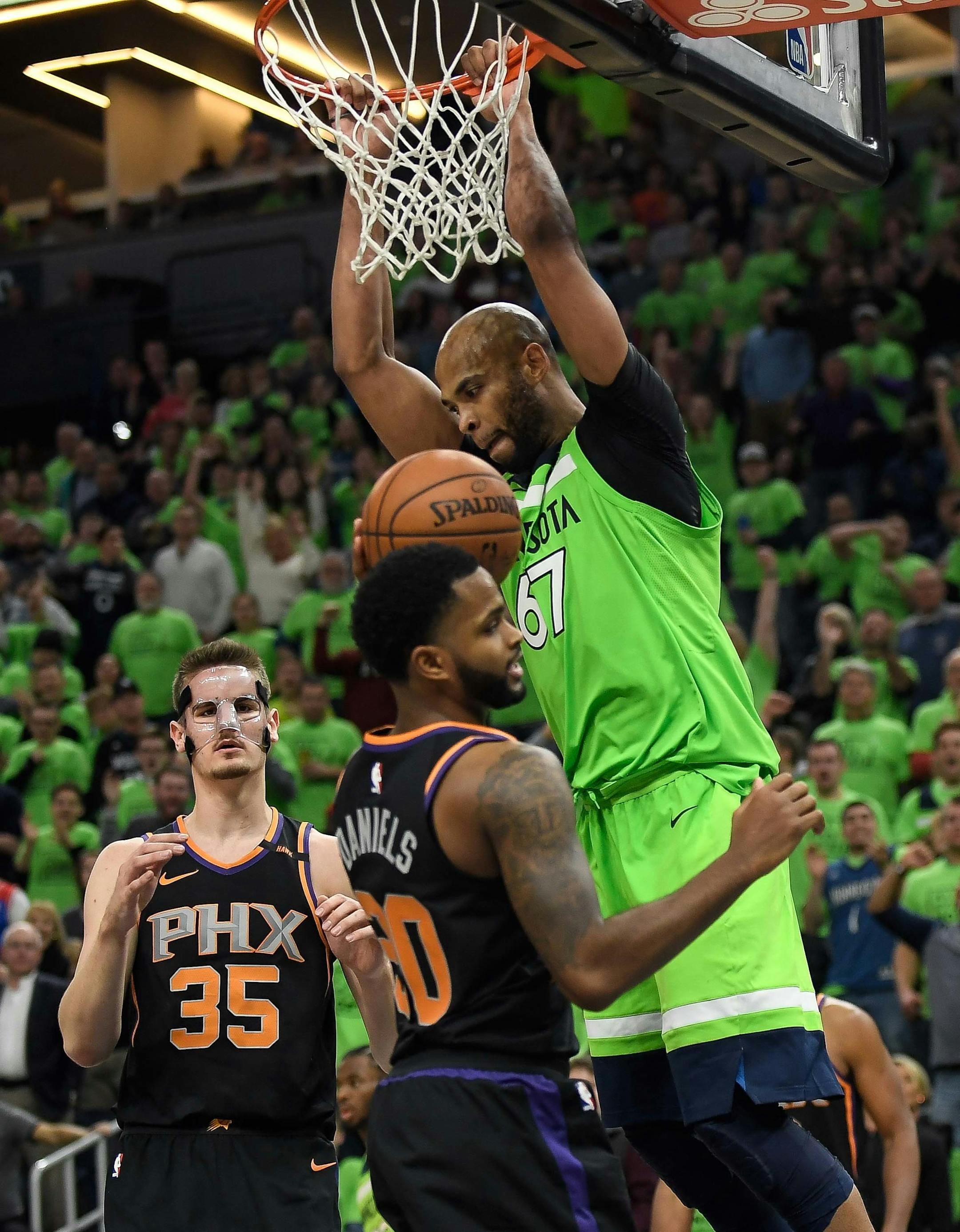Minnesota Timberwolves forward Taj Gibson (67) dunked the ball to give the Timberwolves a short-lived lead in the fourth quarter. ] AARON LAVINSKY ï aaron.lavinsky@startribune.com The Minnesota Timberwolves played the Phoenix Suns on Saturday, Dec. 16, 2017 at Target Center in Minneapolis, Minn.
