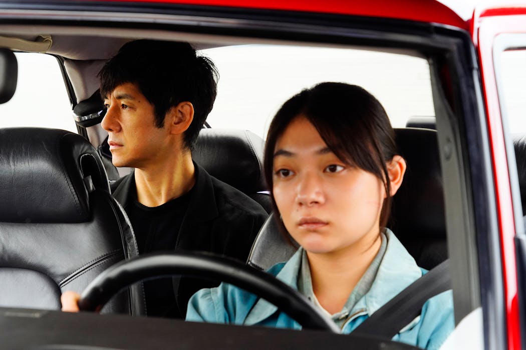 Hidetoshi Nishijima, left, and Toko Miura share loss and guilt in “Drive My Car.” 