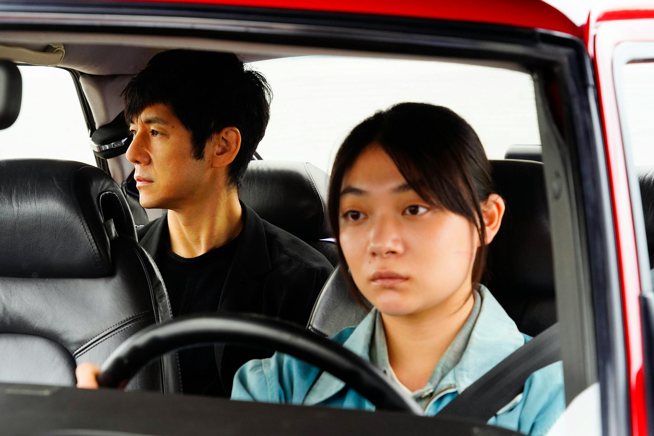 This image released by Janus Films and Sideshow shows Hidetoshi Nishijima, left, and Toko Miura in a scene from "Drive My Car." (Janus Films and Sideshow via AP)