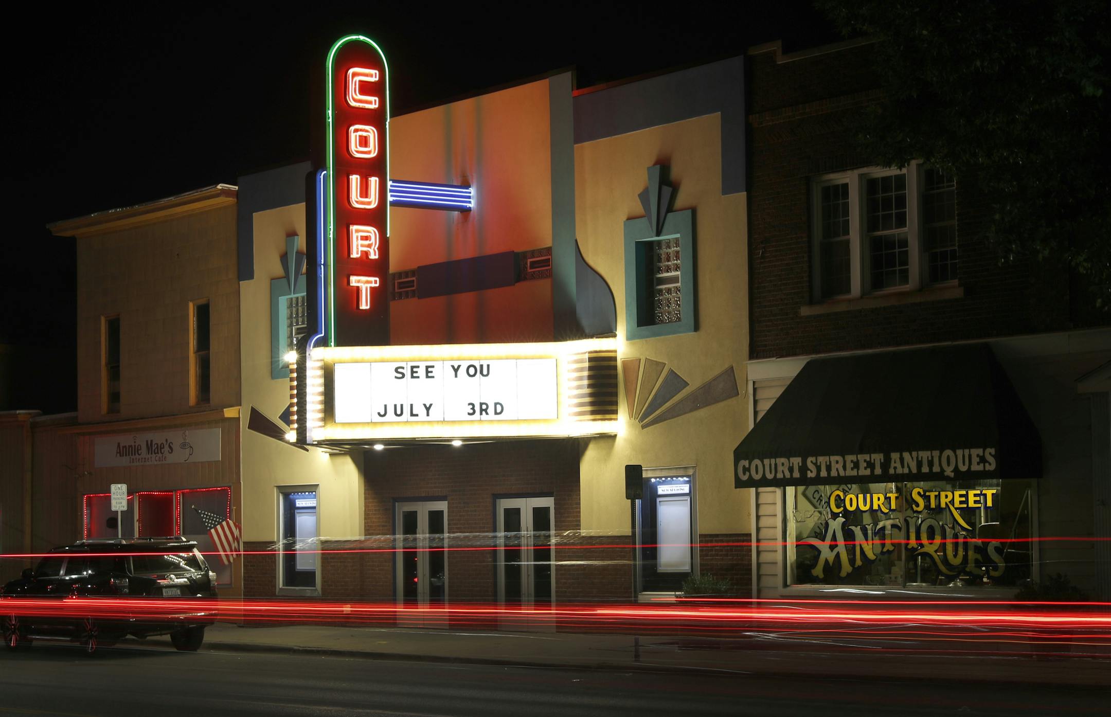 Traffic passes by the Court Street Theatre Monday, June 29, 2020, as the marque signals its reopening date in Saginaw, Mich. The unemployment rate around Saginaw is now 25.6%. (AP Photo/Charles Rex Arbogast)