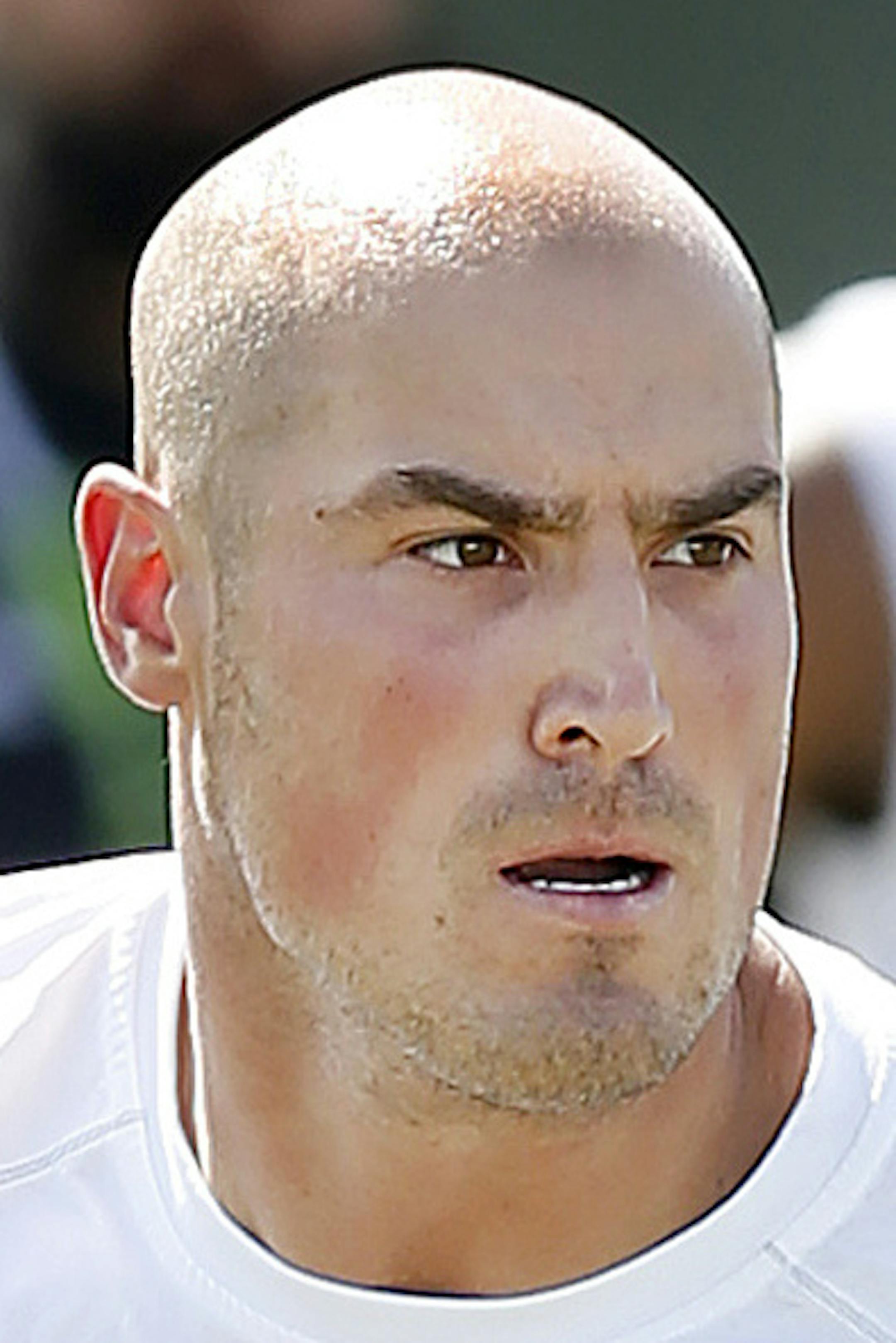 Quarterback Michael Kafka rolls out to pass during the NFL veterans combine football workout, Sunday, March 22, 2015, in Tempe, Ariz. (AP Photo/Rick Scuteri) ORG XMIT: MIN2015040117060167