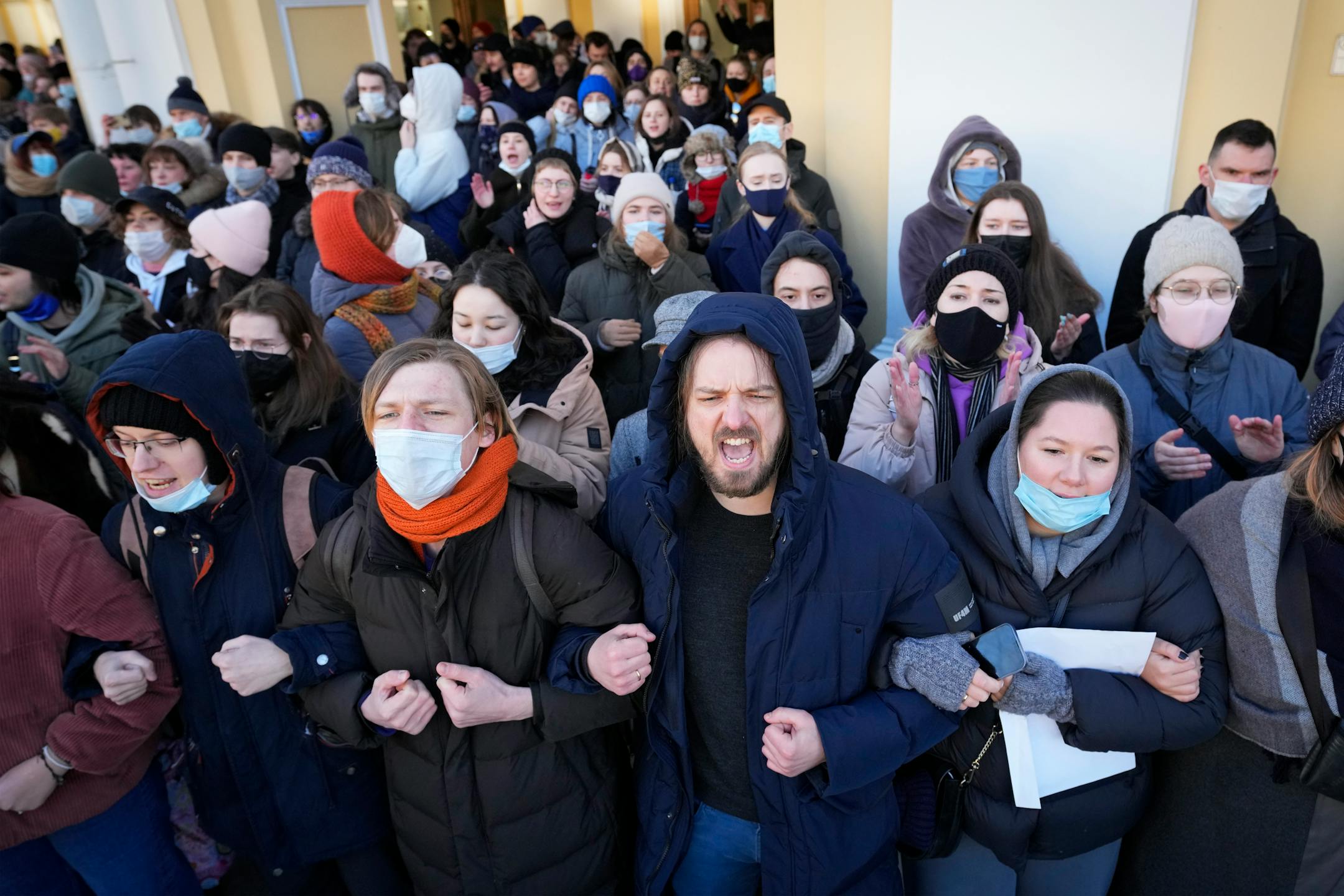 Demonstrators shout slogans during an action against Russia's attack on Ukraine in St. Petersburg, Russia, Sunday, Feb. 27, 2022. Protests against the Russian invasion of Ukraine resumed on Sunday, with people taking to the streets of Moscow and St. Petersburg and other Russian towns for the third straight day despite mass arrests. (AP Photo/Dmitri Lovetsky)