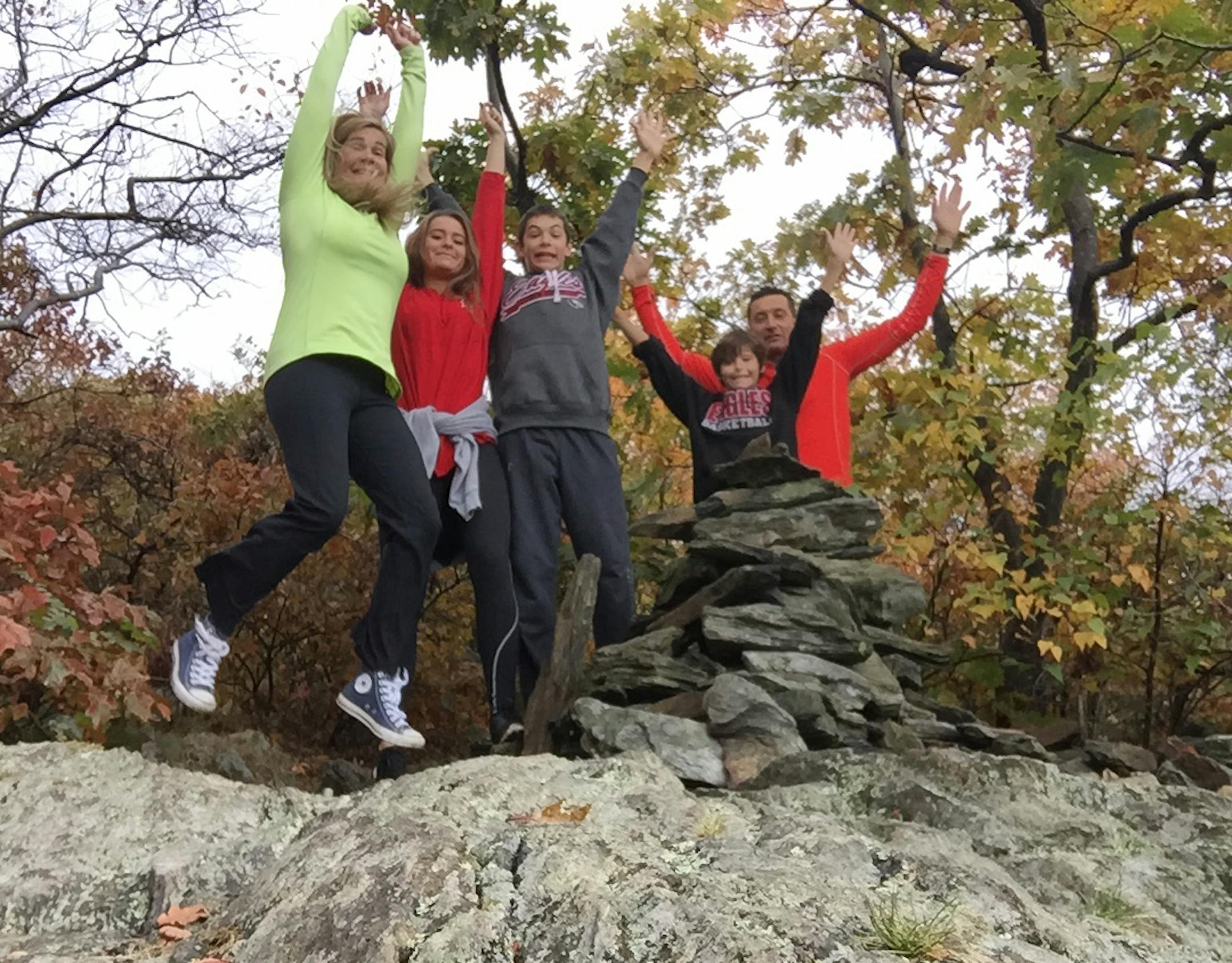 The picture of everyone jumping is on Mt Frissell the highest point in Connecticut on October 16th 2015 ñthe day before my 50th birthday. That was my 50th and final highpoint. The family members from left to right are my wife Heidi, my daughter Taryn, my son Timmy, my son Teddy and me.
